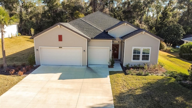 19551 SW 77th Loop, Dunnellon, FL 34432 - view of front of property featuring an attached garage, concrete driveway, a front yard, and view of wooded area
