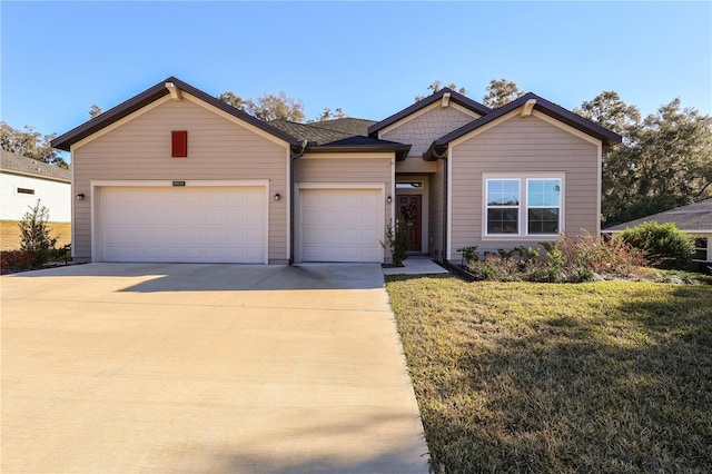 19551 SW 77th Loop, Dunnellon, FL 34432 - view of front of home with an attached garage, concrete driveway, and a front lawn