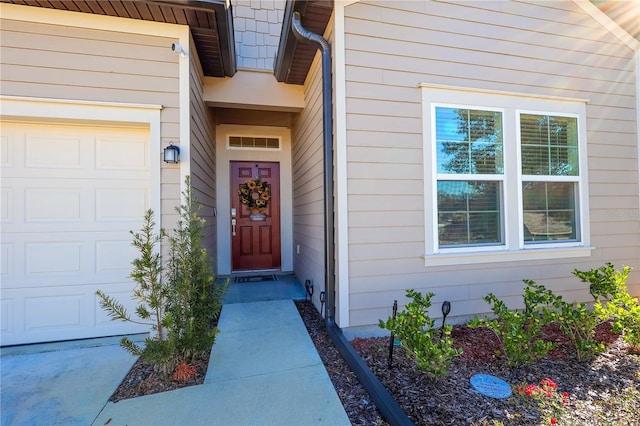 19551 SW 77th Loop, Dunnellon, FL 34432 - property entrance featuring an attached garage