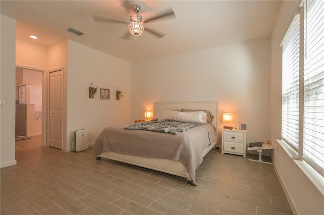 19551 SW 77th Loop, Dunnellon, FL 34432 - bedroom featuring multiple windows, wood finished floors, baseboards, and recessed lighting