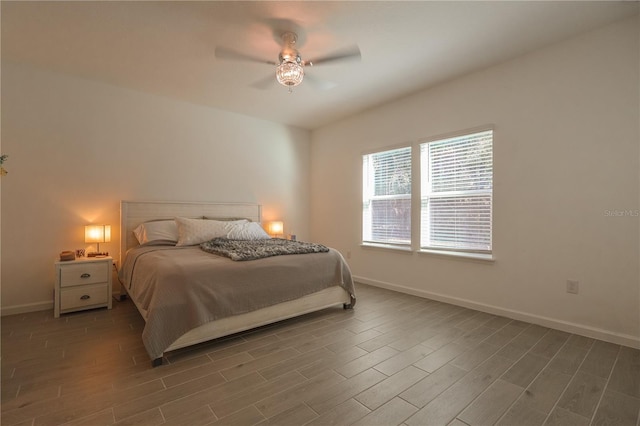 19551 SW 77th Loop, Dunnellon, FL 34432 - bedroom with wood finished floors, baseboards, and a ceiling fan