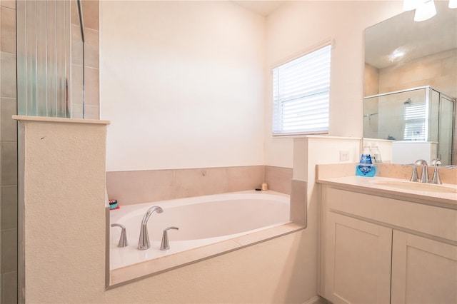 19551 SW 77th Loop, Dunnellon, FL 34432 - bathroom featuring a stall shower, a bath, and vanity