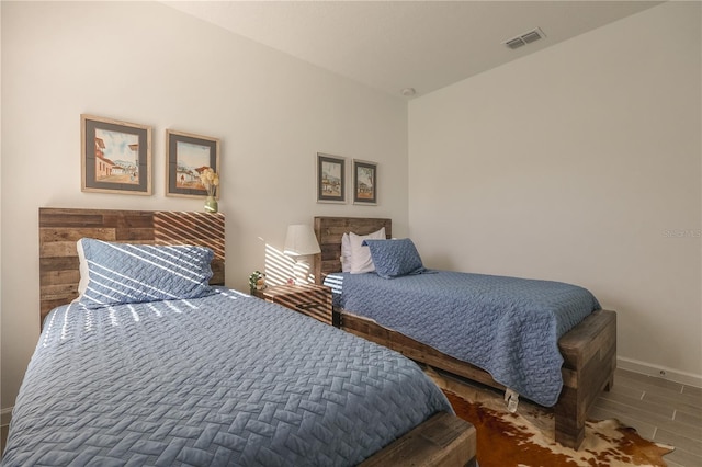 19551 SW 77th Loop, Dunnellon, FL 34432 - bedroom featuring baseboards and wood finished floors
