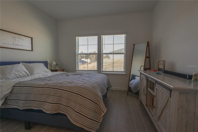 19551 SW 77th Loop, Dunnellon, FL 34432 - bedroom featuring dark wood-type flooring and baseboards