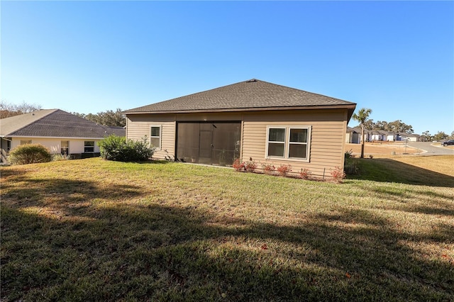 19551 SW 77th Loop, Dunnellon, FL 34432 - rear view of property with a lawn