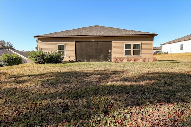 19551 SW 77th Loop, Dunnellon, FL 34432 - rear view of property featuring a yard and a sunroom