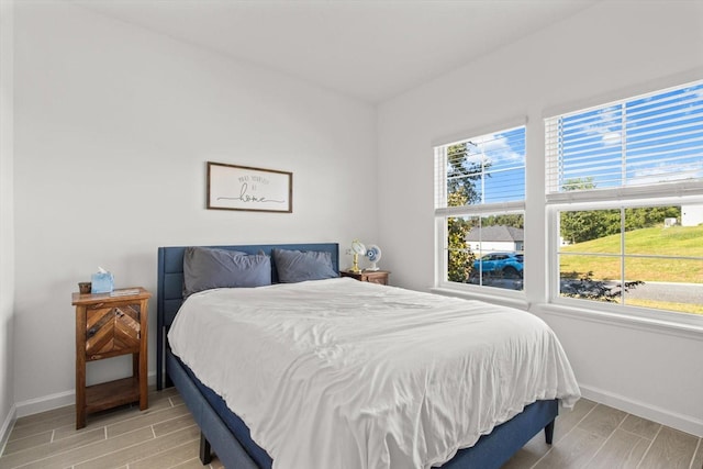 19551 SW 77th Loop, Dunnellon, FL 34432 - bedroom with wood tiled floors and baseboards