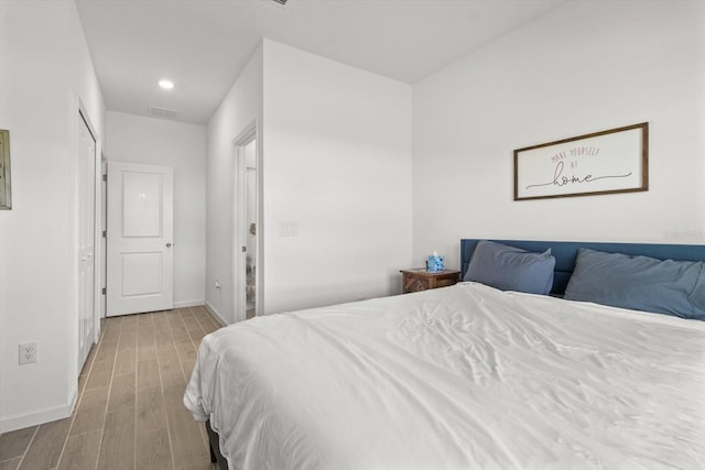 19551 SW 77th Loop, Dunnellon, FL 34432 - bedroom with wood finished floors and recessed lighting