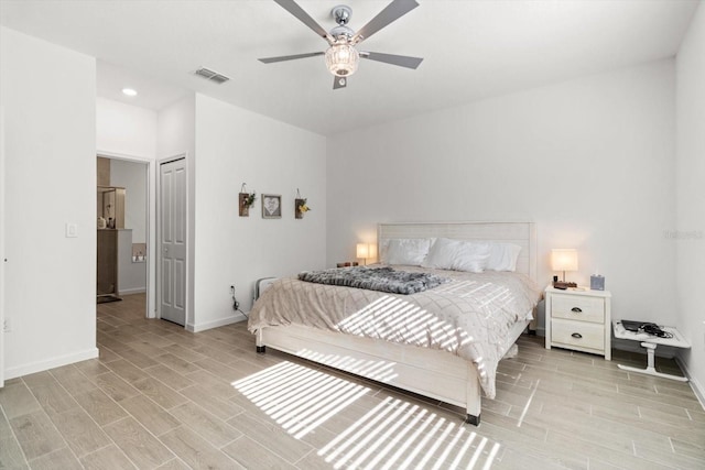 19551 SW 77th Loop, Dunnellon, FL 34432 - bedroom with light wood-style flooring, a ceiling fan, and recessed lighting
