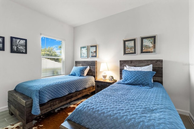 19551 SW 77th Loop, Dunnellon, FL 34432 - bedroom featuring baseboards and wood finished floors