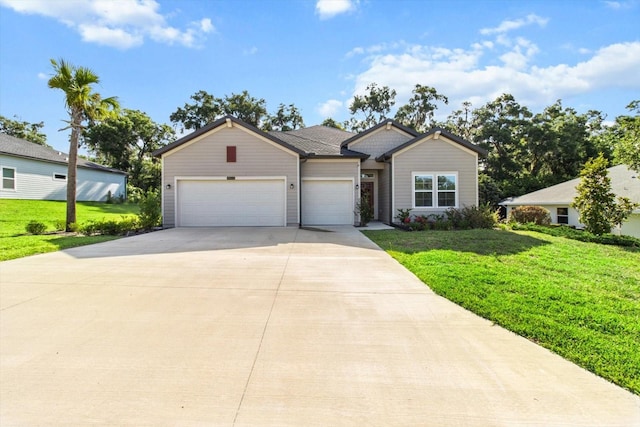 19551 SW 77th Loop, Dunnellon, FL 34432 - view of front of property featuring an attached garage, driveway, and a front yard
