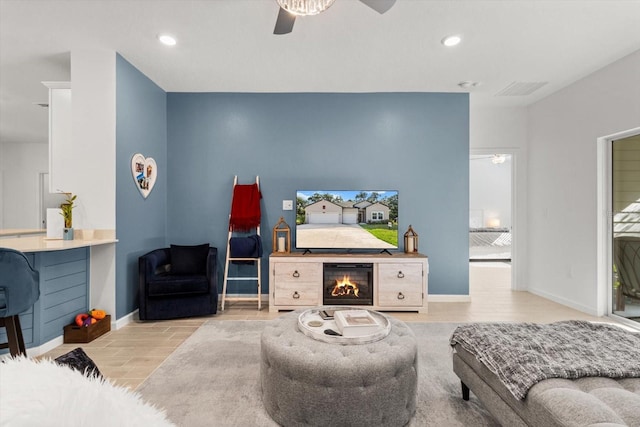 19551 SW 77th Loop, Dunnellon, FL 34432 - living room with a ceiling fan, wood finished floors, and recessed lighting