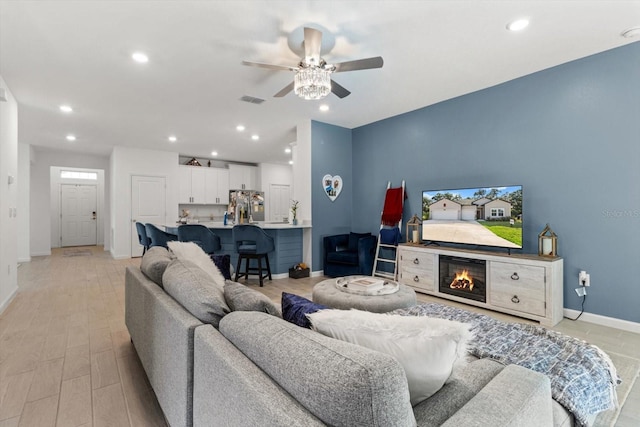19551 SW 77th Loop, Dunnellon, FL 34432 - living area with a ceiling fan, recessed lighting, and a glass covered fireplace