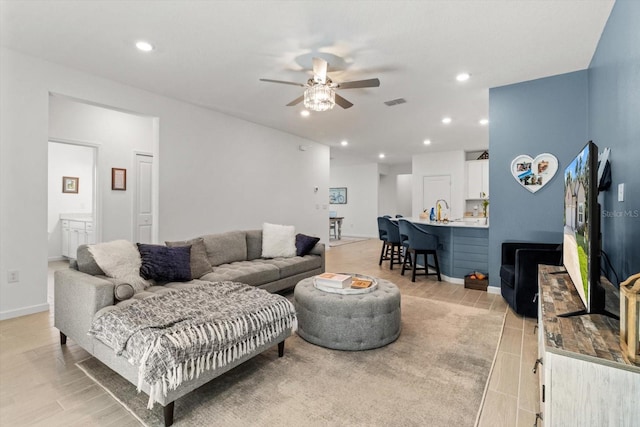 19551 SW 77th Loop, Dunnellon, FL 34432 - living room with ceiling fan, recessed lighting, and light wood-type flooring