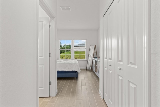 19551 SW 77th Loop, Dunnellon, FL 34432 - hallway featuring wood finish floors and baseboards