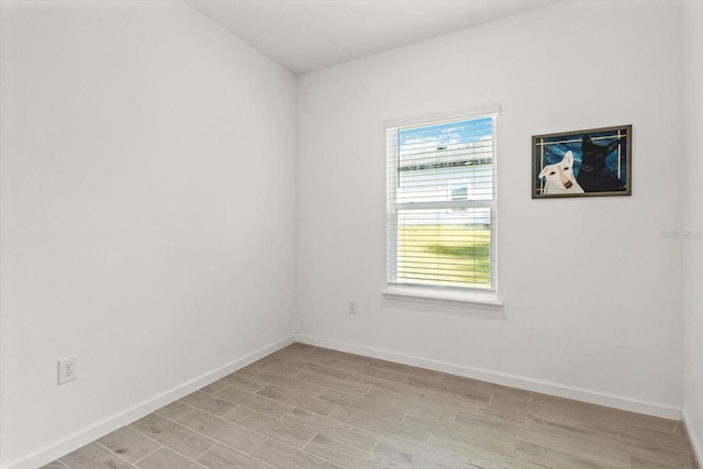 19551 SW 77th Loop, Dunnellon, FL 34432 - unfurnished room with light wood finished floors and baseboards