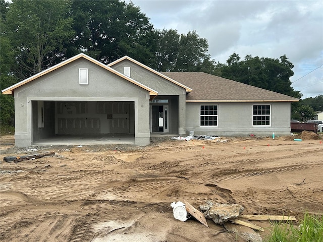 2 Pine Course Trl, Ocala, FL 34472 - property under construction with an attached garage, stucco siding, and a shingled roof