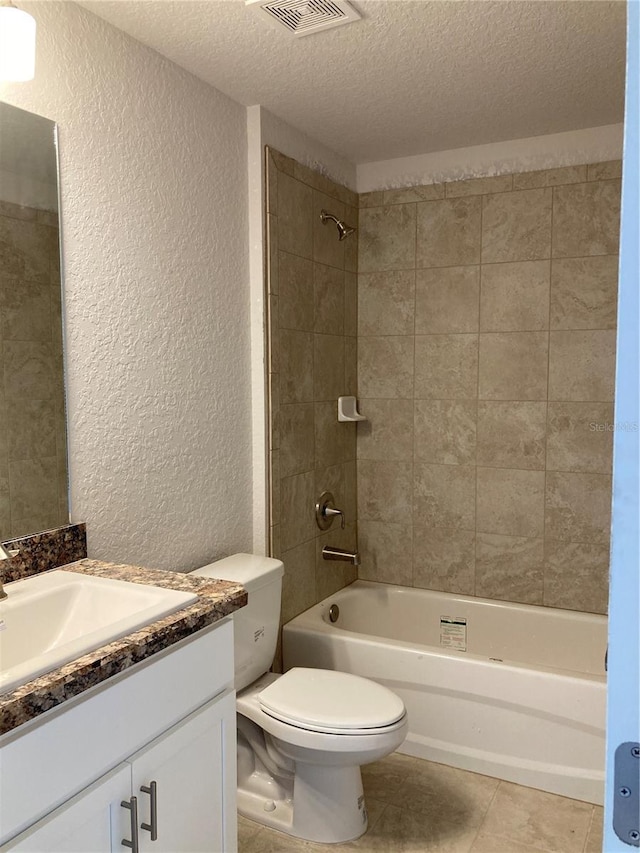 2 Pine Course Trl, Ocala, FL 34472 - full bathroom with a textured wall, a textured ceiling, toilet, vanity, and tile patterned floors