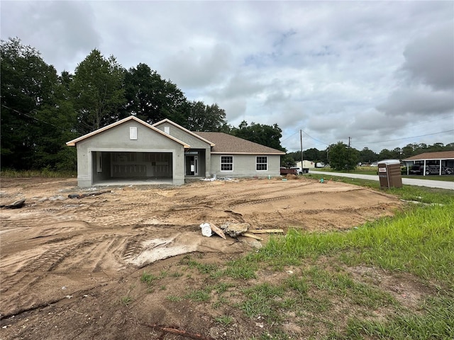 2 Pine Course Trl, Ocala, FL 34472 - view of front of home featuring an attached garage, driveway, and stucco siding