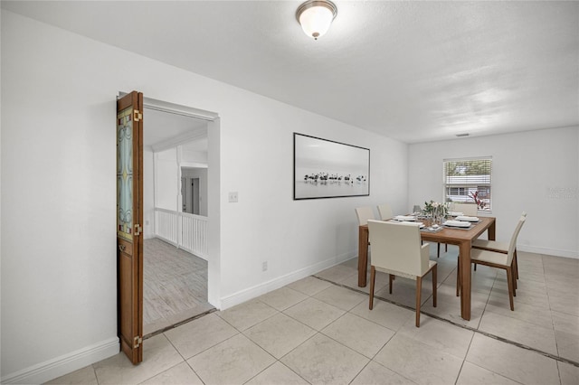 3331 SE 4th St, Ocala, FL 34471 - dining space featuring baseboards and light tile patterned flooring