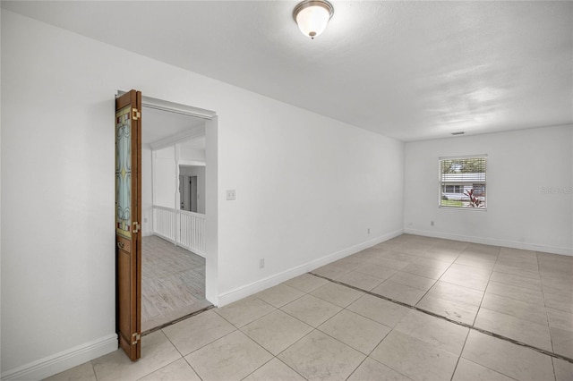 3331 SE 4th St, Ocala, FL 34471 - empty room featuring light tile patterned flooring and baseboards
