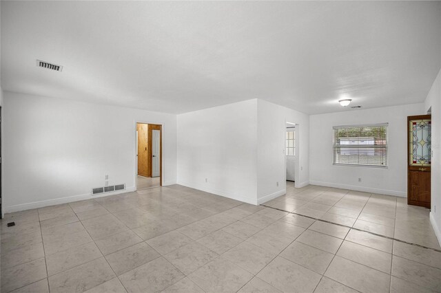3331 SE 4th St, Ocala, FL 34471 - spare room with light tile patterned floors and baseboards