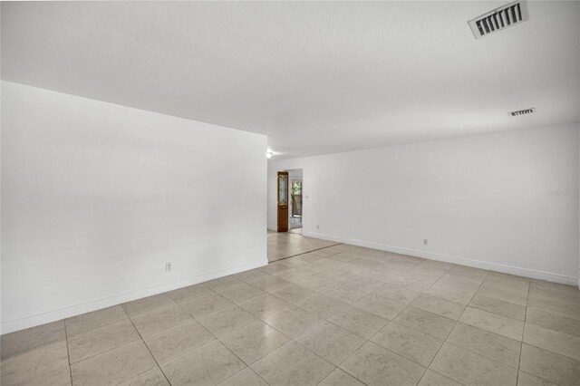 3331 SE 4th St, Ocala, FL 34471 - spare room featuring baseboards and light tile patterned flooring