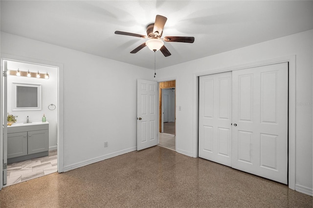 3331 SE 4th St, Ocala, FL 34471 - unfurnished bedroom featuring a closet, baseboards, ensuite bath, a sink, and a ceiling fan