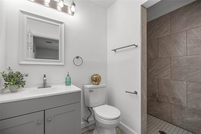 3331 SE 4th St, Ocala, FL 34471 - full bathroom with vanity, toilet, tiled shower, and baseboards