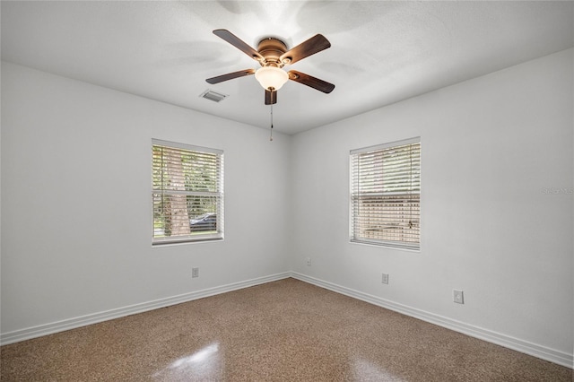 3331 SE 4th St, Ocala, FL 34471 - spare room with baseboards, a ceiling fan, and speckled floor
