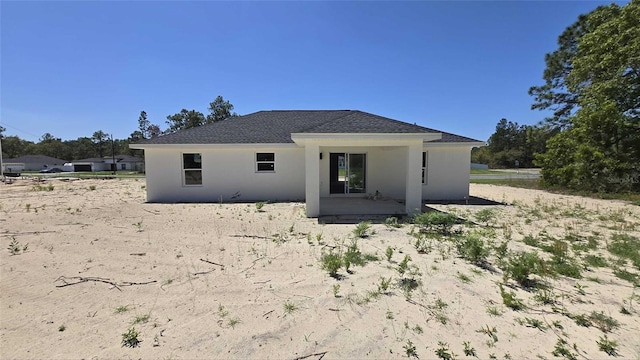 717 Marion Oaks Mnr, Ocala, FL 34473 - back of property featuring stucco siding and roof with shingles
