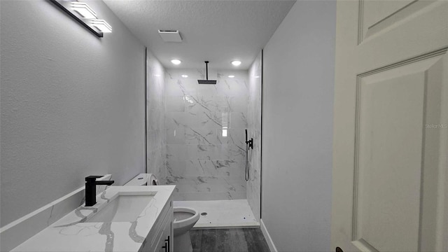 717 Marion Oaks Mnr, Ocala, FL 34473 - bathroom featuring a textured ceiling, a marble finish shower, vanity, and recessed lighting