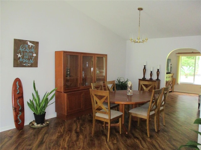 14192 SW 112th Cir, Dunnellon, FL 34432 - dining area featuring dark wood finished floors, arched walkways, a chandelier, baseboards, and high vaulted ceiling
