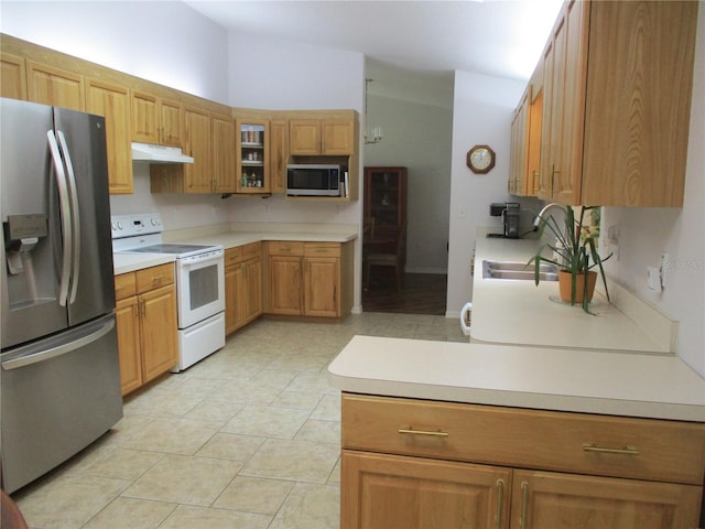 14192 SW 112th Cir, Dunnellon, FL 34432 - kitchen featuring appliances with stainless steel finishes, under cabinet range hood, glass insert cabinets, light countertops, and light tile patterned floors