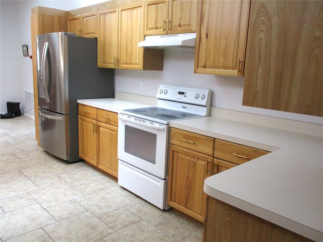14192 SW 112th Cir, Dunnellon, FL 34432 - kitchen with white electric stove, under cabinet range hood, light countertops, and freestanding refrigerator