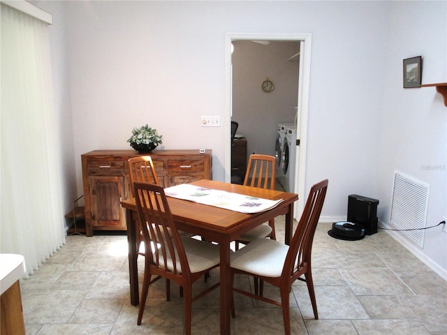 14192 SW 112th Cir, Dunnellon, FL 34432 - dining room featuring washing machine and dryer