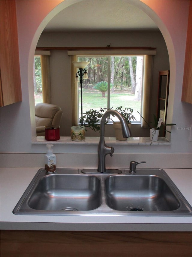 14192 SW 112th Cir, Dunnellon, FL 34432 - kitchen view of a sink, arched walkways, and light countertops