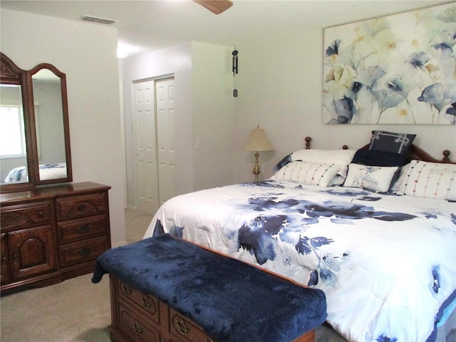 14192 SW 112th Cir, Dunnellon, FL 34432 - bedroom with light carpet, a closet, and ceiling fan