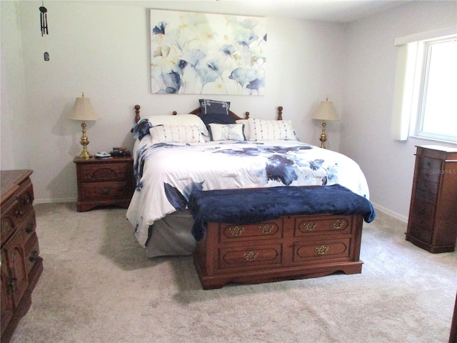 14192 SW 112th Cir, Dunnellon, FL 34432 - bedroom featuring light colored carpet and baseboards
