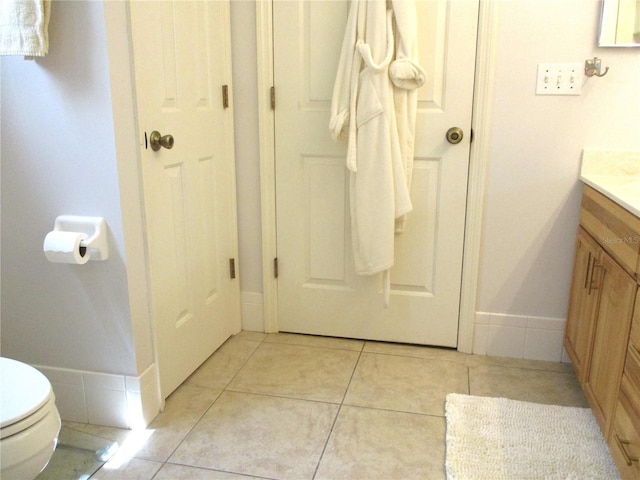 14192 SW 112th Cir, Dunnellon, FL 34432 - bathroom with vanity, toilet, baseboards, and tile patterned floors