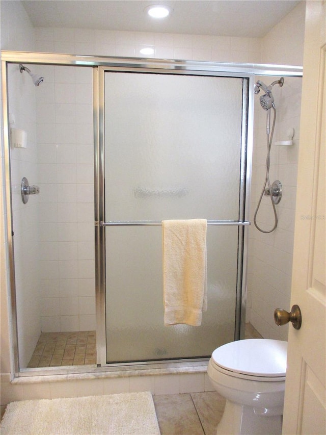 14192 SW 112th Cir, Dunnellon, FL 34432 - full bathroom featuring toilet, a stall shower, tile patterned flooring, and recessed lighting