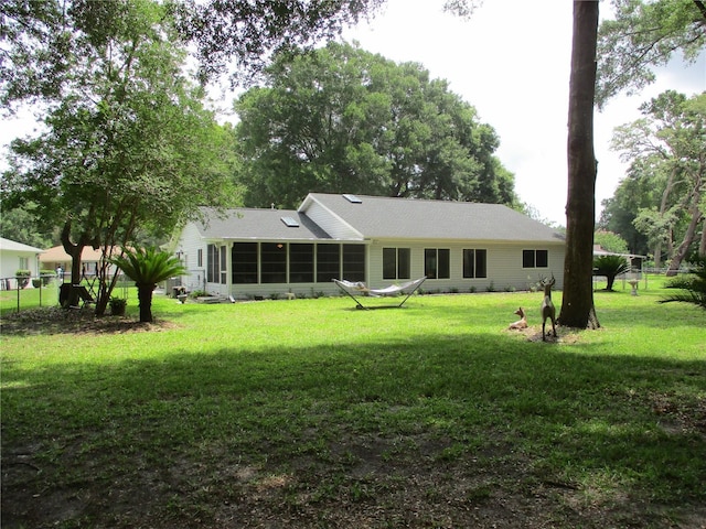 14192 SW 112th Cir, Dunnellon, FL 34432 - back of house featuring a sunroom