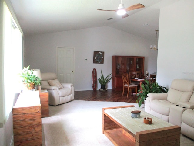 14192 SW 112th Cir, Dunnellon, FL 34432 - living area with vaulted ceiling, a ceiling fan, wood finished floors, a chandelier, and baseboards