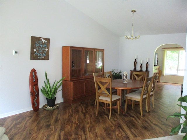 14192 SW 112th Cir, Dunnellon, FL 34432 - dining space with arched walkways, dark wood-style flooring, a chandelier, baseboards, and high vaulted ceiling