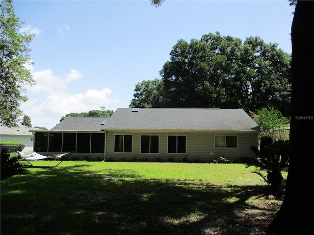 14192 SW 112th Cir, Dunnellon, FL 34432 - rear view of property featuring a yard and a sunroom