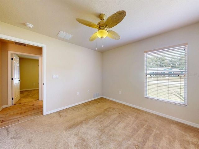 8080 N Susan Ave, Dunnellon, FL 34433 - spare room featuring light carpet, a smoke detector, and ceiling fan