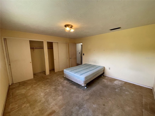104 S Jeffery St, Beverly Hills, FL 34465 - carpeted bedroom featuring multiple closets