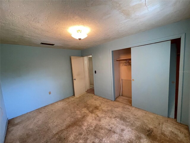 104 S Jeffery St, Beverly Hills, FL 34465 - unfurnished bedroom with a closet, carpet flooring, and a textured ceiling