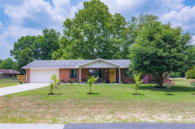 126 SW Mockingbird Way, Lake City, FL 32024 - ranch-style house featuring brick siding, a garage, driveway, and covered porch