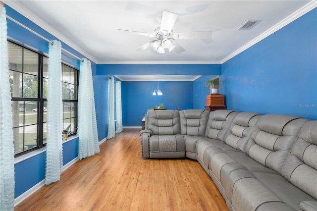126 SW Mockingbird Way, Lake City, FL 32024 - living area with baseboards, wood finished floors, crown molding, and a ceiling fan